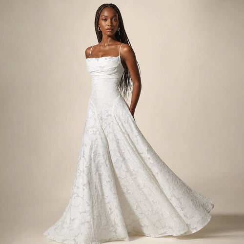 Model wearing Sledyn White floral maxi dress, full-length front view showing bodice fit and skirt sweep