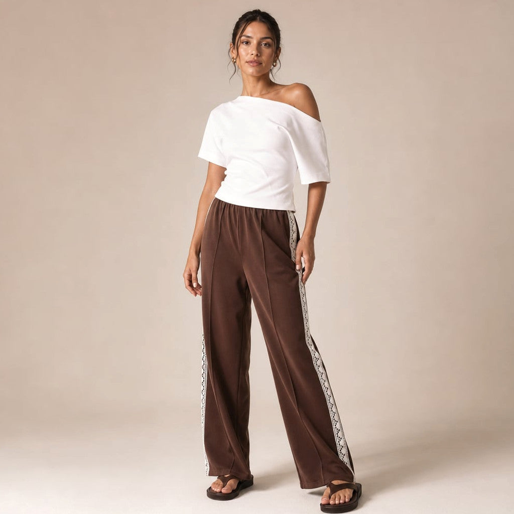 Isaiah racer stripe pleated trackpants in chocolate with lace ankle trim, full-length front view on model