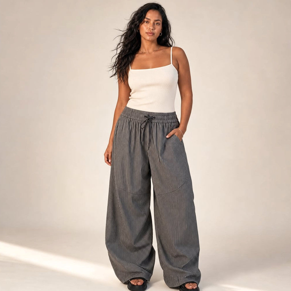 Wide barrel-leg trousers in grey with elasticated waist, full-length rounded silhouette on a 162 cm model wearing size S