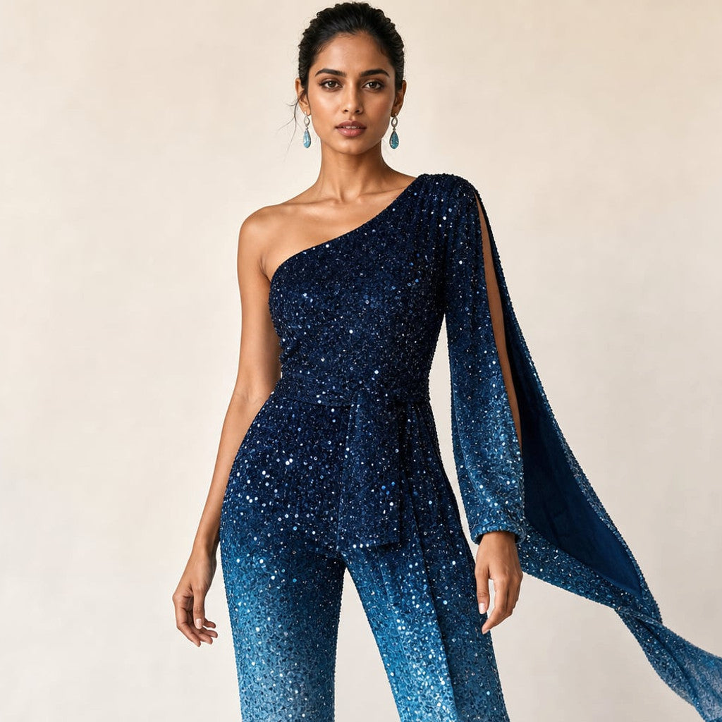 Full-length front view of the Loren wide-leg one-shoulder jumpsuit in blue ombre, floor-sweeping flare silhouette