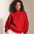Model wearing Harita red bell-sleeve turtleneck knit sweater, boxy fit, shown from the front against a neutral background