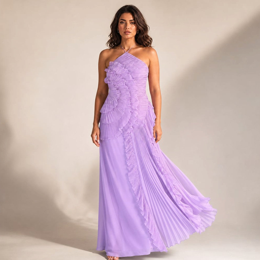 Purple halter maxi dress with asymmetric pleated ruffles sweeping from the structured bodice to the floor, photographed front-facing