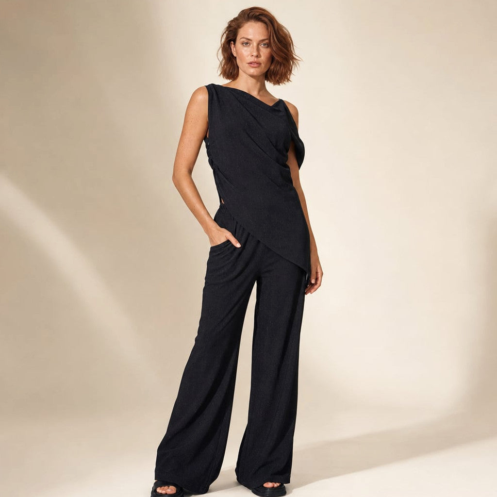 Parkel off-shoulder asymmetric co-ord set in black cotton with wide-leg pants, front view on plain background