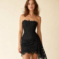 Model wearing the Neiez lace corset mini dress in Black, close fit through waist and hip, sleeveless lace bodice with integrated corset shaping