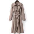 Model wearing Tildar oversized longline trench coat in mocha, collar raised, belt fastened, paired with ankle boots
