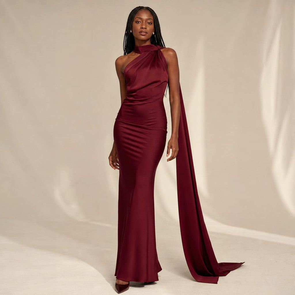 Model wearing Dwyn draped one-shoulder maxi dress in wine red, full-length silhouette