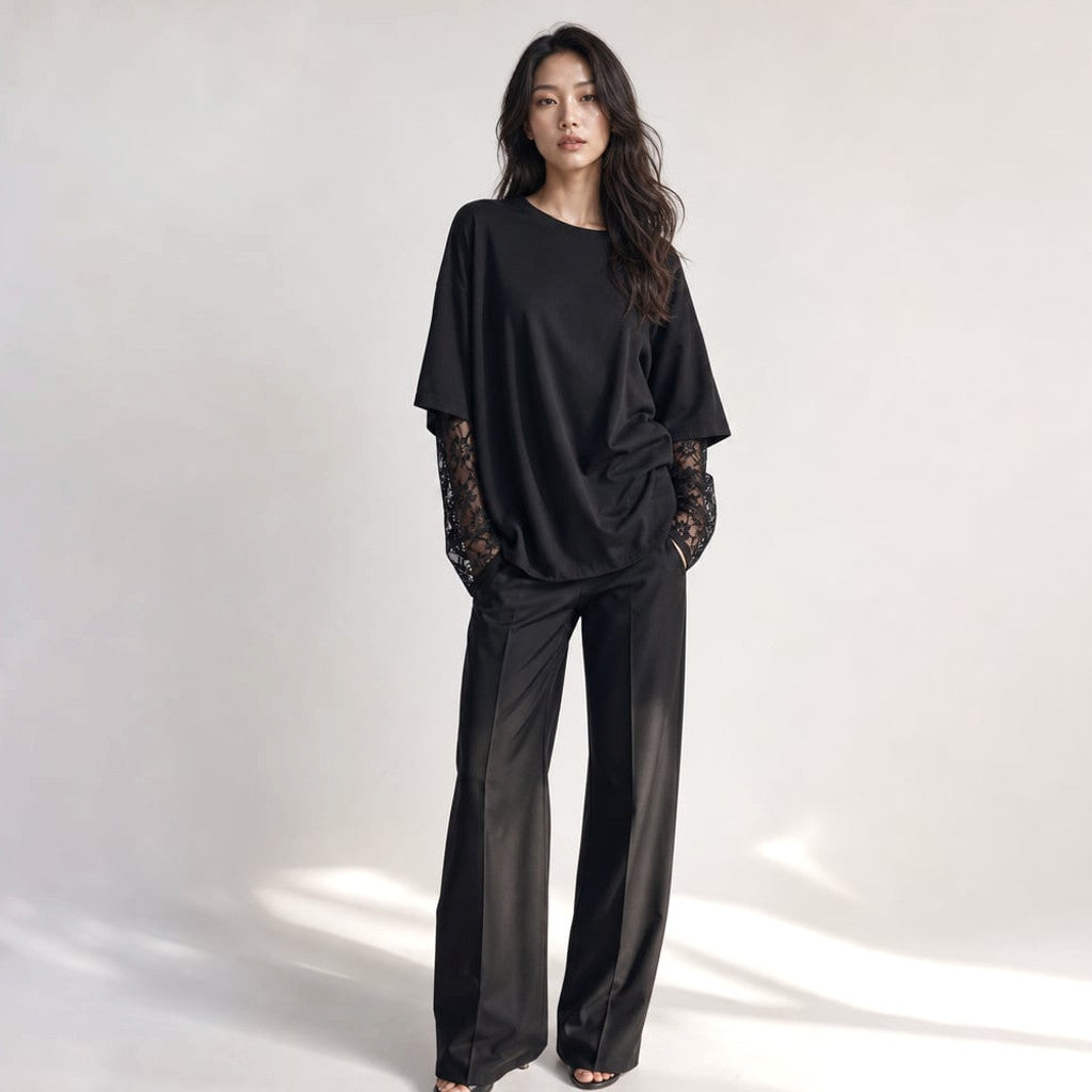Francesca knit top in black with sheer lace sleeve detail, front full-body view against a neutral background
