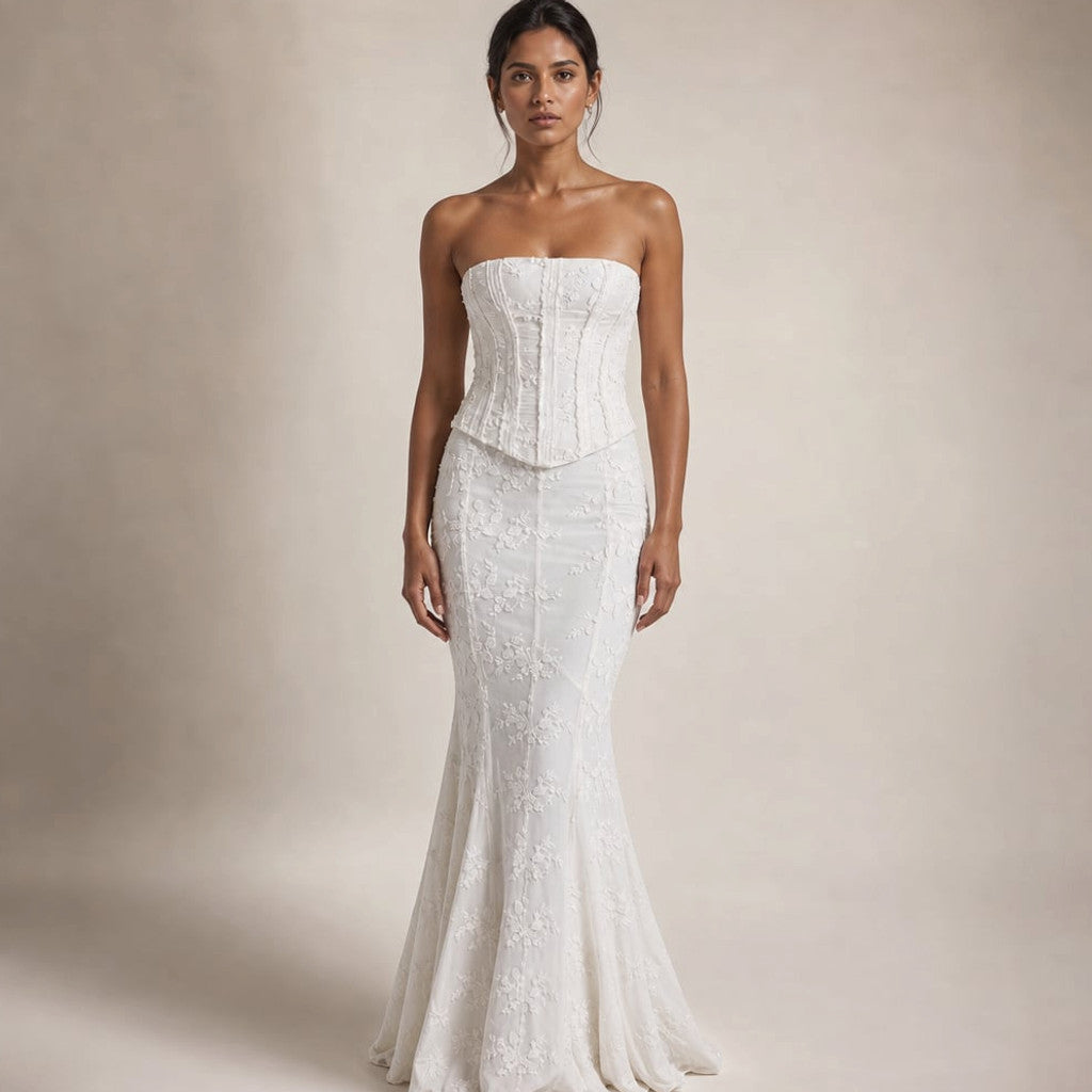 Strapless white mermaid maxi dress with lace corset bodice and floor-length flare, front view on model