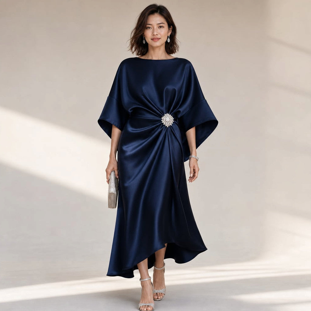 Melo satin-finish knit midi dress in navy blue with wide kimono sleeves and crystal brooch waist detail, front view