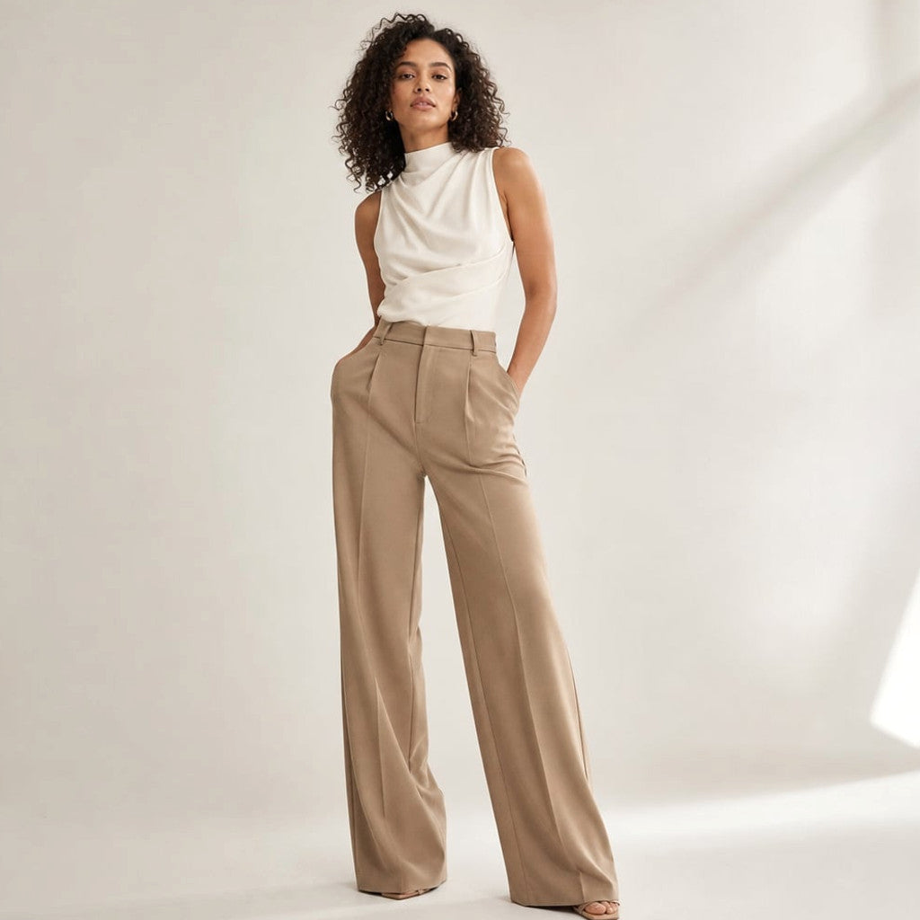 Model wearing Teva high-waist wide-leg tailored trouser in camel summer-weight fabric, front view