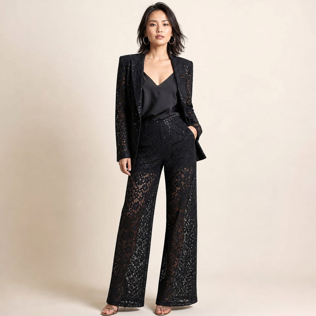 Varis two-piece floral lace set in black — single-button peplum blazer with notch lapel and matching wide-leg trousers, front view on white background