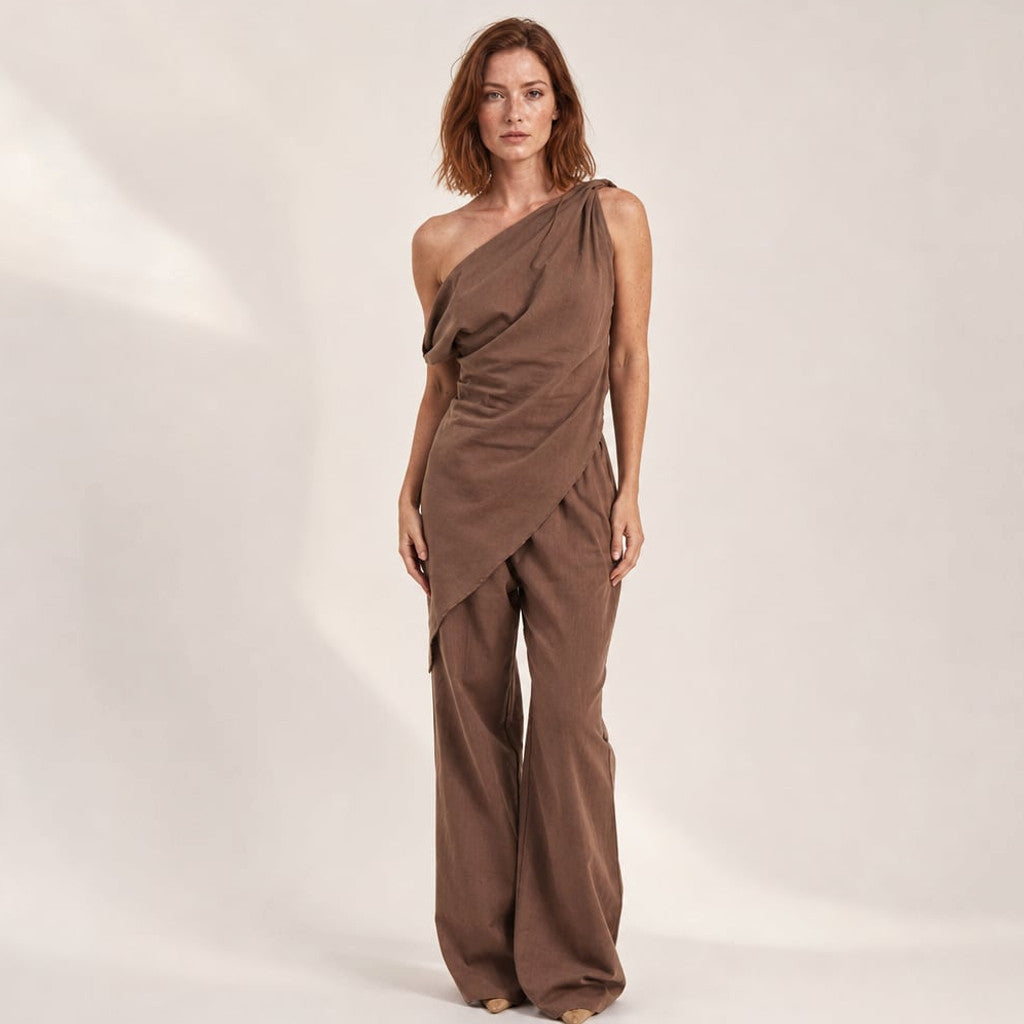 Tasi off-shoulder co-ord set in chocolate — asymmetric neckline top and wide-leg cotton trousers, front view